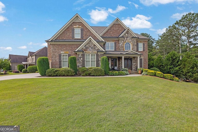 2450 Weber Heights Way, Buford, GA 30519 - view of front of property with brick siding, a front lawn, and covered porch