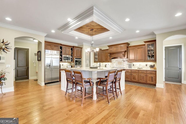 2450 Weber Heights Way, Buford, GA 30519 - dining space featuring arched walkways, ornamental molding, light wood-style flooring, a chandelier, and recessed lighting