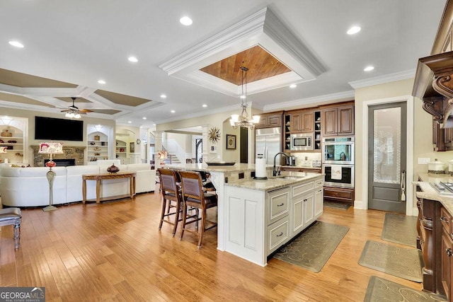 2450 Weber Heights Way, Buford, GA 30519 - kitchen featuring coffered ceiling, built in appliances, crown molding, open floor plan, and ceiling fan