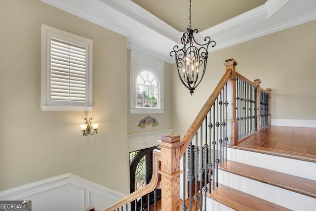 2450 Weber Heights Way, Buford, GA 30519 - staircase with a chandelier, ornamental molding, and wood finished floors