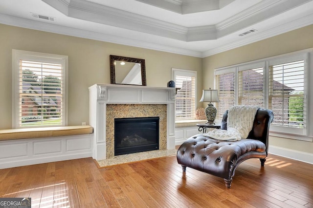 2450 Weber Heights Way, Buford, GA 30519 - sitting room with a raised ceiling, light wood-type flooring, a fireplace, crown molding, and baseboards