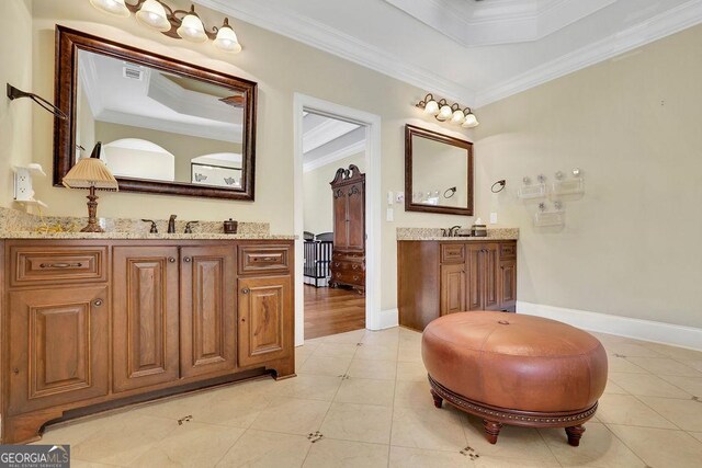2450 Weber Heights Way, Buford, GA 30519 - bathroom with crown molding, a raised ceiling, two vanities, and tile patterned flooring