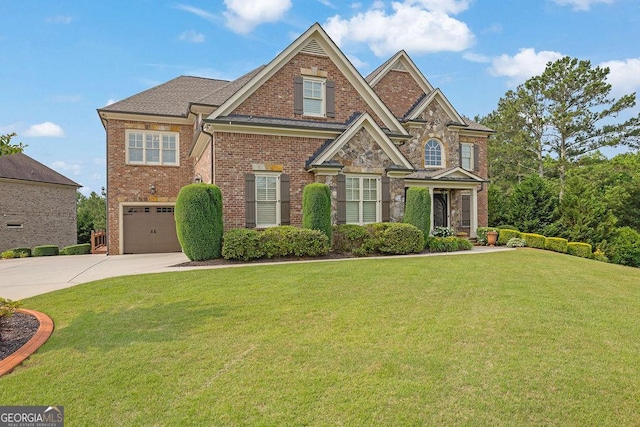 2450 Weber Heights Way, Buford, GA 30519 - view of front facade featuring driveway, a garage, brick siding, and a front yard