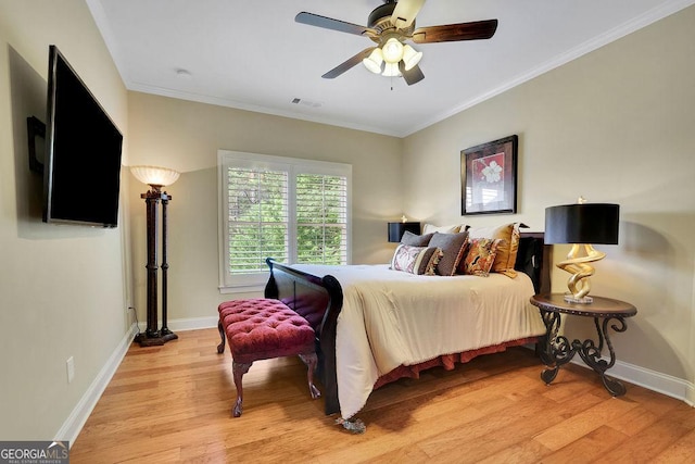 2450 Weber Heights Way, Buford, GA 30519 - bedroom with light wood-style floors, baseboards, ornamental molding, and a ceiling fan