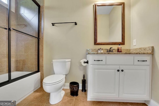 2450 Weber Heights Way, Buford, GA 30519 - bathroom featuring toilet, vanity, baseboards, bath / shower combo with glass door, and tile patterned flooring