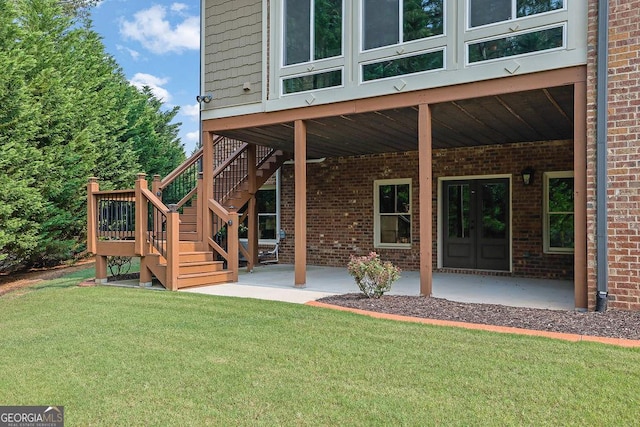 2450 Weber Heights Way, Buford, GA 30519 - property entrance with a yard, a patio, and brick siding