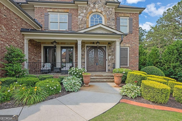 2450 Weber Heights Way, Buford, GA 30519 - property entrance featuring covered porch and brick siding