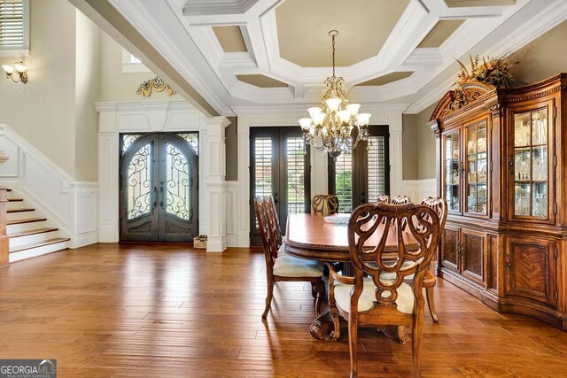 2450 Weber Heights Way, Buford, GA 30519 - dining room featuring french doors, a decorative wall, a chandelier, stairway, and ornamental molding