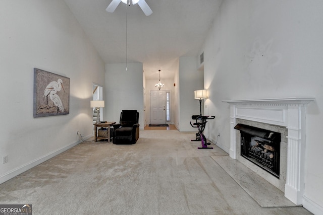 2790 Meadow Gate Way, Loganville, GA 30052 - living area featuring carpet floors, a premium fireplace, ceiling fan, baseboards, and a high ceiling
