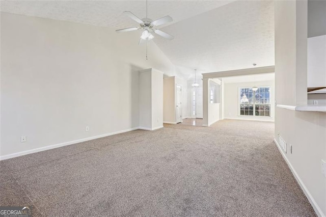245 London Ln, Hiram, GA 30141 - unfurnished living room with carpet flooring, lofted ceiling, and a ceiling fan
