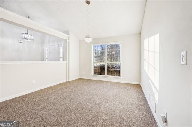 245 London Ln, Hiram, GA 30141 - spare room with carpet flooring and a chandelier