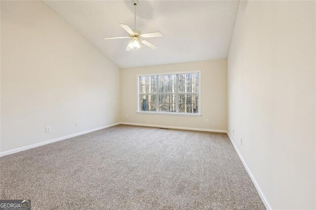 245 London Ln, Hiram, GA 30141 - spare room with carpet floors, vaulted ceiling, and a ceiling fan