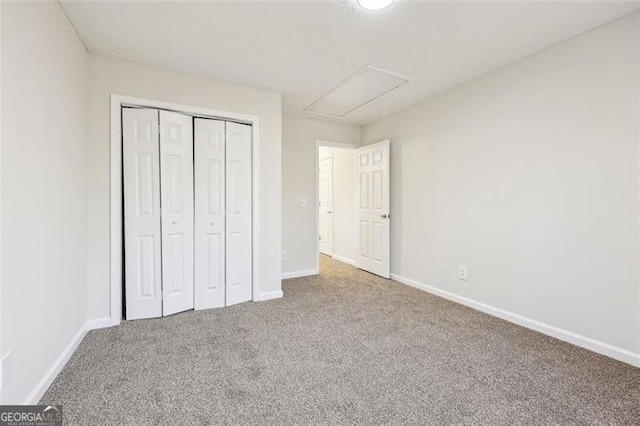 245 London Ln, Hiram, GA 30141 - unfurnished bedroom with carpet floors, a closet, and attic access