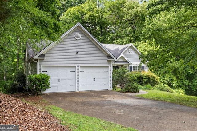 245 London Ln, Hiram, GA 30141 - ranch-style home with concrete driveway and an attached garage