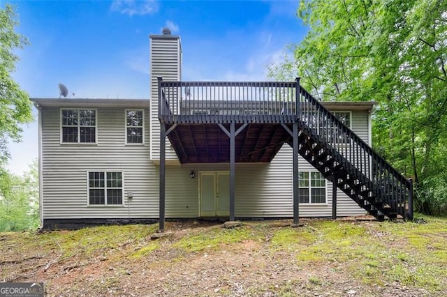 245 London Ln, Hiram, GA 30141 - rear view of property featuring stairs, a wooden deck, and a chimney