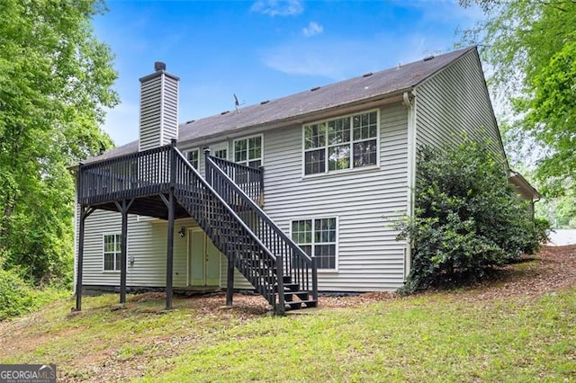 245 London Ln, Hiram, GA 30141 - back of property featuring a wooden deck, stairway, a chimney, and a lawn