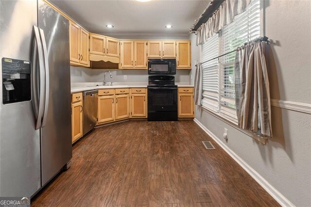 233 Oakridge Dr, Cartersville, GA 30121 - kitchen featuring black appliances, light countertops, dark wood-style floors, light brown cabinetry, and recessed lighting
