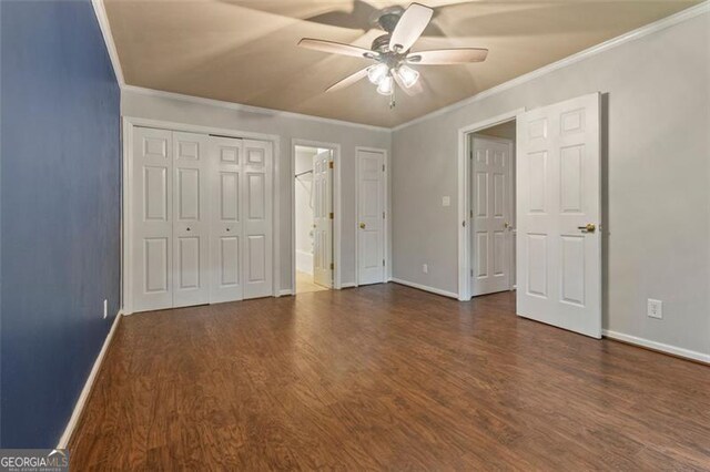 233 Oakridge Dr, Cartersville, GA 30121 - unfurnished bedroom with dark wood-style flooring, baseboards, ornamental molding, ceiling fan, and ensuite bathroom