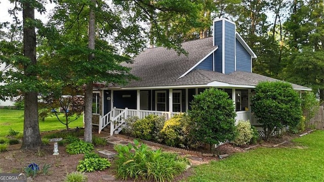 233 Oakridge Dr, Cartersville, GA 30121 - view of front facade with a chimney, roof with shingles, covered porch, and a front lawn