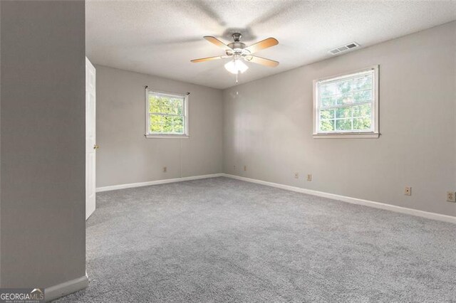 233 Oakridge Dr, Cartersville, GA 30121 - empty room featuring a ceiling fan, baseboards, carpet, and a textured ceiling