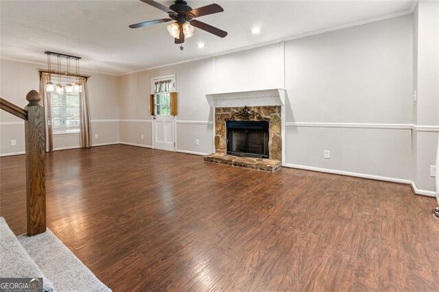 233 Oakridge Dr, Cartersville, GA 30121 - unfurnished living room featuring a ceiling fan, wood finished floors, crown molding, baseboards, and a fireplace