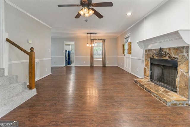 233 Oakridge Dr, Cartersville, GA 30121 - unfurnished living room featuring wood finished floors, a ceiling fan, stairs, a fireplace, and ornamental molding