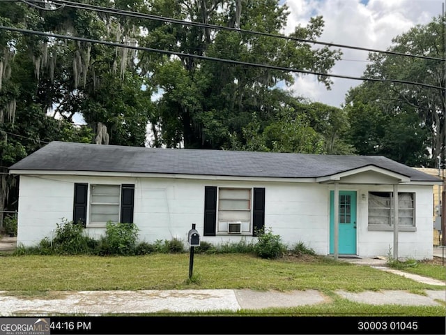 2214 Shell Rd, Savannah, GA 31404 - ranch-style home with a front lawn, a shingled roof, and view of scattered trees