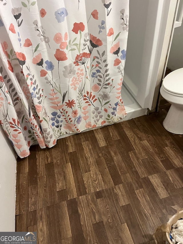 2214 Shell Rd, Savannah, GA 31404 - full bathroom featuring wood finished floors, toilet, and a shower with shower curtain