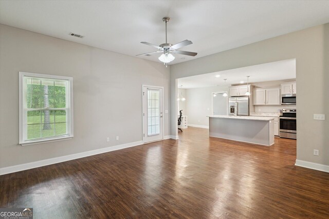 178 Stonebrook Way, Statesboro, GA 30458 - unfurnished living room featuring dark wood finished floors, a ceiling fan, and baseboards