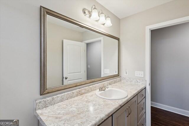 178 Stonebrook Way, Statesboro, GA 30458 - bathroom featuring vanity, wood finished floors, and baseboards