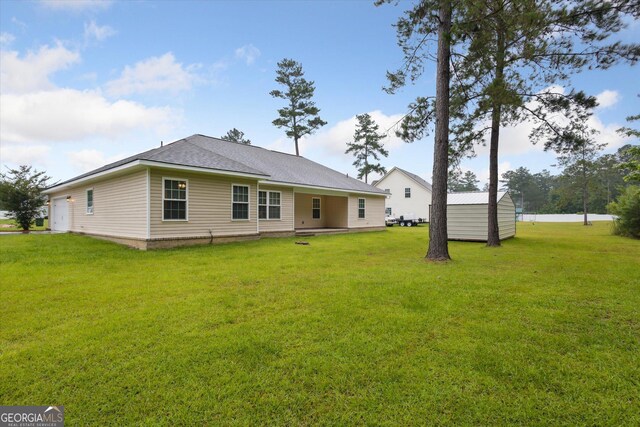 178 Stonebrook Way, Statesboro, GA 30458 - rear view of property featuring a yard and roof with shingles