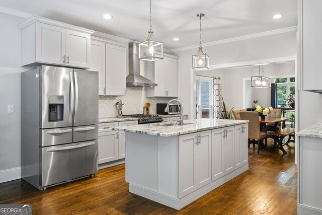 1010 Longcreek Pointe Pointe, Alpharetta, GA 30005 - kitchen with appliances with stainless steel finishes, wall chimney range hood, tasteful backsplash, white cabinetry, and recessed lighting