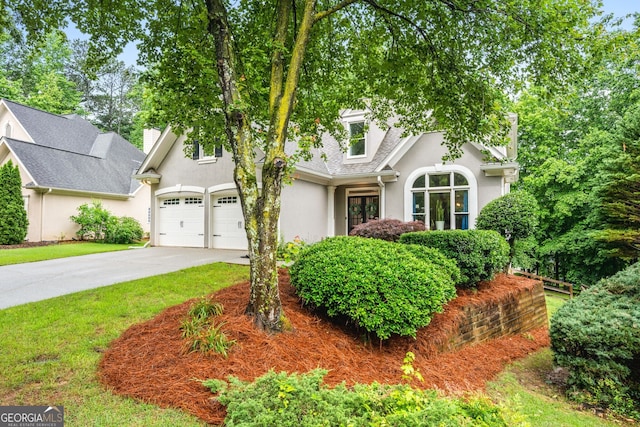 1010 Longcreek Pointe Pointe, Alpharetta, GA 30005 - view of front facade featuring stucco siding, concrete driveway, and a garage