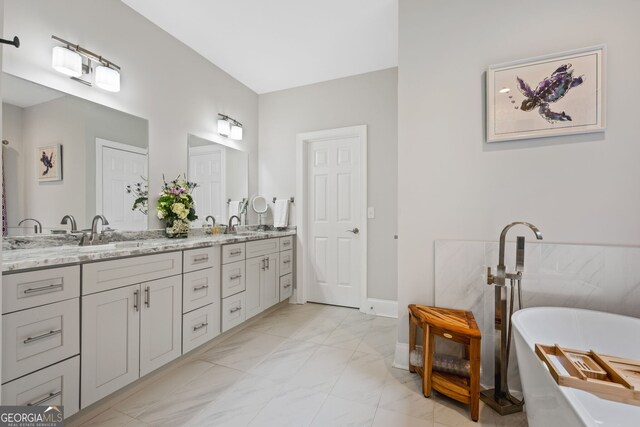 1010 Longcreek Pointe Pointe, Alpharetta, GA 30005 - full bath featuring marble look tiles, double vanity, a freestanding tub, and baseboards