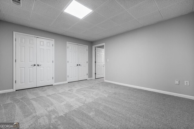 1010 Longcreek Pointe Pointe, Alpharetta, GA 30005 - unfurnished bedroom with a drop ceiling, two closets, carpet, and baseboards