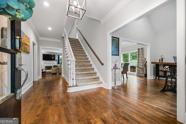 1010 Longcreek Pointe Pointe, Alpharetta, GA 30005 - foyer entrance featuring a fireplace, stairway, wood finished floors, baseboards, and ornamental molding