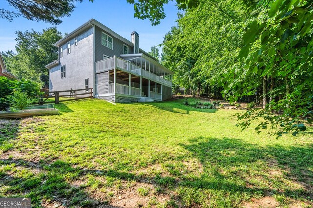 1010 Longcreek Pointe Pointe, Alpharetta, GA 30005 - view of yard with a sunroom and a wooden deck