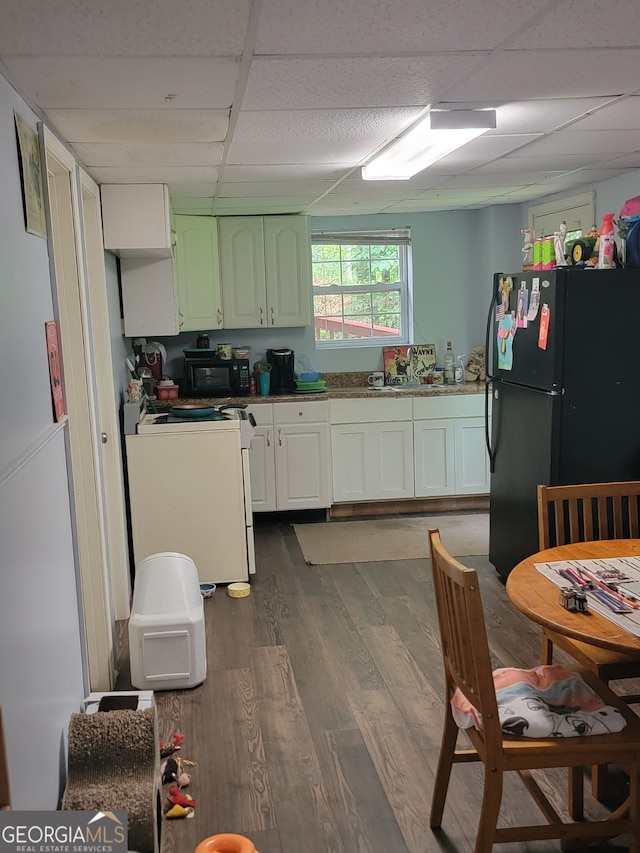 6305 Eidson Dr, Cumming, GA 30041 - kitchen with black appliances, a drop ceiling, and dark wood-type flooring