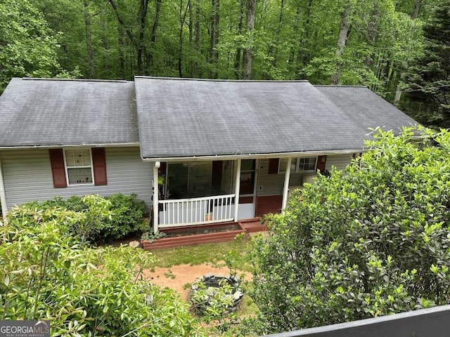 6305 Eidson Dr, Cumming, GA 30041 - view of front of property with a porch and a view of trees
