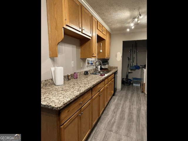 6305 Eidson Dr, Cumming, GA 30041 - kitchen featuring ornamental molding, a textured ceiling, wood finished floors, brown cabinetry, and black dishwasher