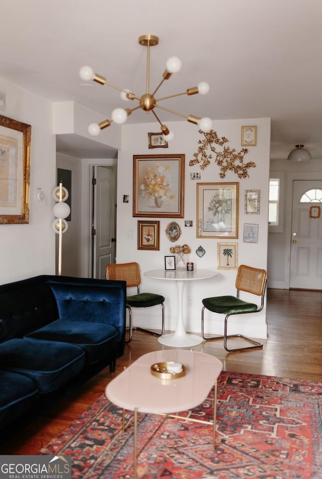 351 Cherokee Ave SE Apt 10, Atlanta, GA 30312 - living room with wood finished floors and a chandelier