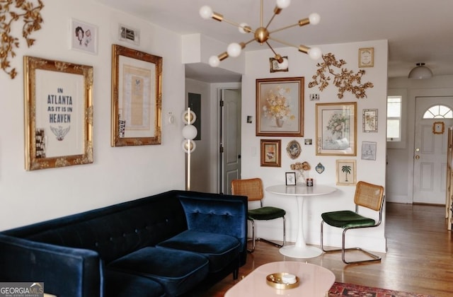 351 Cherokee Ave SE Apt 10, Atlanta, GA 30312 - living room with wood finished floors and a chandelier