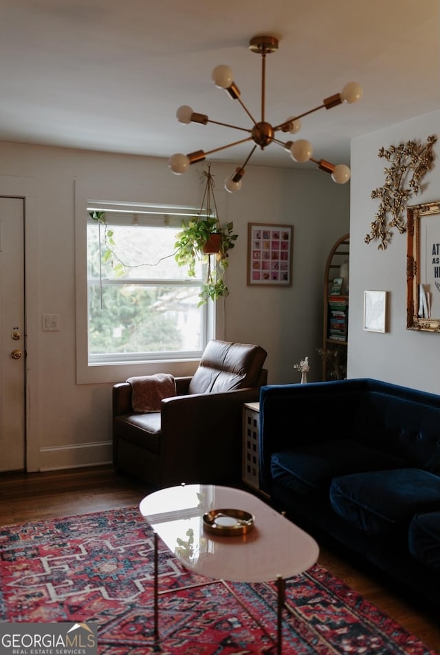 351 Cherokee Ave SE Apt 10, Atlanta, GA 30312 - living room featuring wood finished floors, baseboards, and a chandelier