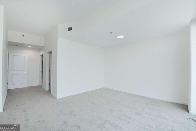 361 17th St NW Unit 1702, Atlanta, GA 30363 - empty room with carpet floors, baseboards, a pendent fire sprinkler, and recessed lighting