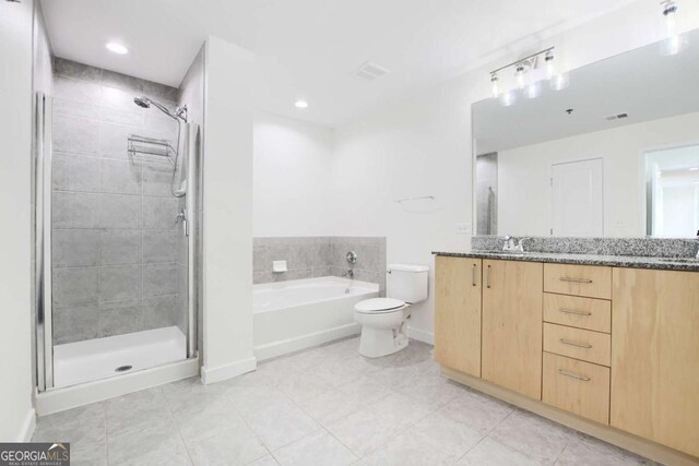 361 17th St NW Unit 1702, Atlanta, GA 30363 - bathroom featuring vanity, a bath, a stall shower, baseboards, and recessed lighting