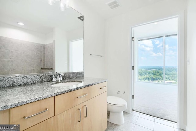 361 17th St NW Unit 1702, Atlanta, GA 30363 - bathroom with vanity, toilet, and tile patterned floors
