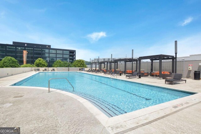 361 17th St NW Unit 1702, Atlanta, GA 30363 - community pool with a pergola and a patio area