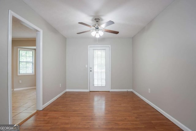 1214 Tyne Way, Stone Mountain, GA 30088 - spare room featuring light wood-style floors, a ceiling fan, and baseboards