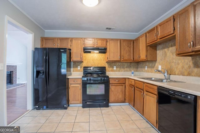1214 Tyne Way, Stone Mountain, GA 30088 - kitchen featuring black appliances, a sink, under cabinet range hood, light countertops, and crown molding