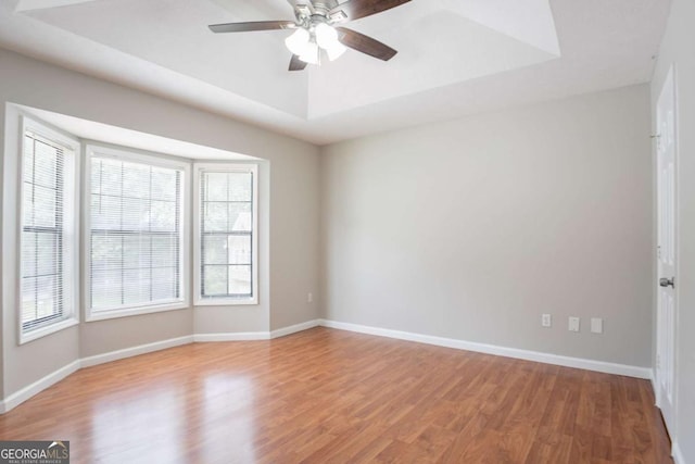 1214 Tyne Way, Stone Mountain, GA 30088 - unfurnished room featuring wood finished floors, healthy amount of natural light, ceiling fan, and baseboards